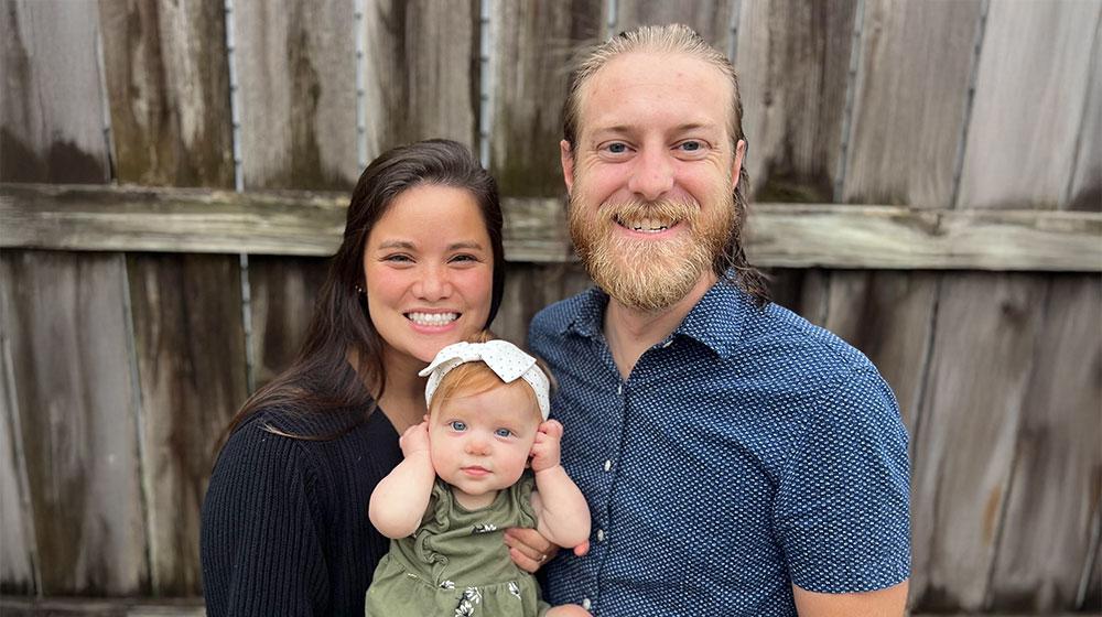 jarrod with his wife and daughter